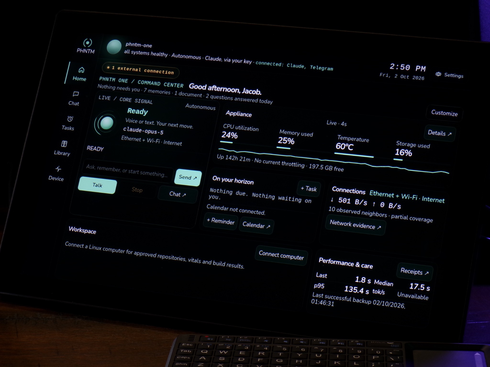 Unretouched close-up photograph of PHNTM One’s updated Home screen, showing chat, tasks, library, and live device status
