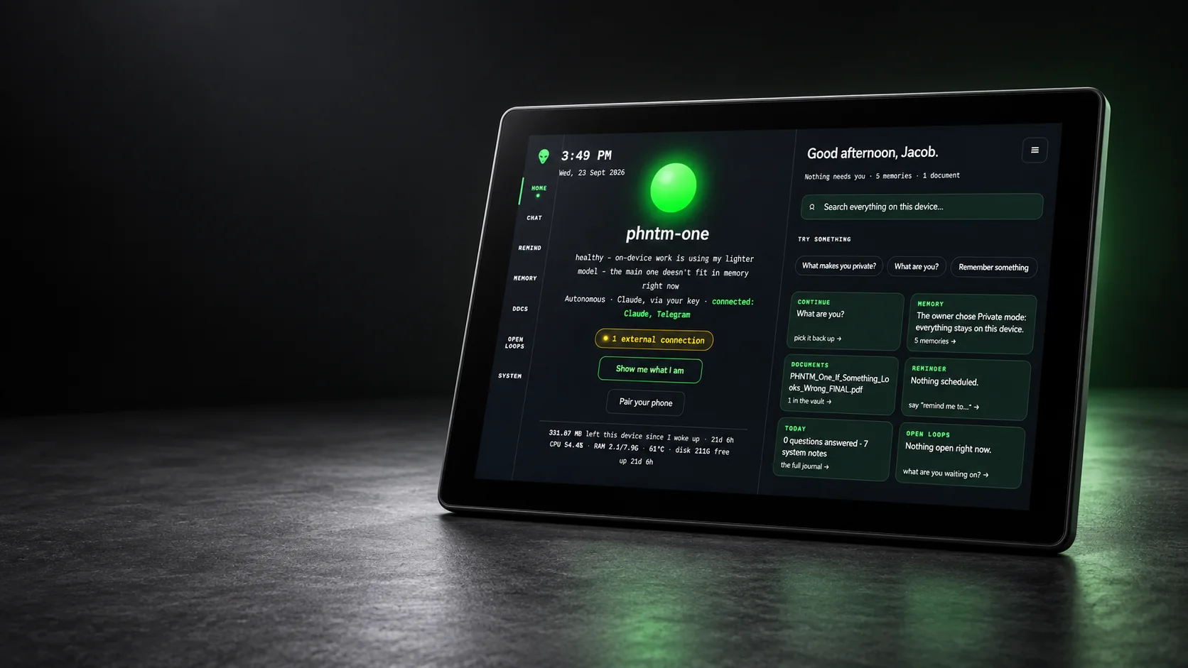 PHNTM One touchscreen assistant on a desk, showing its home screen